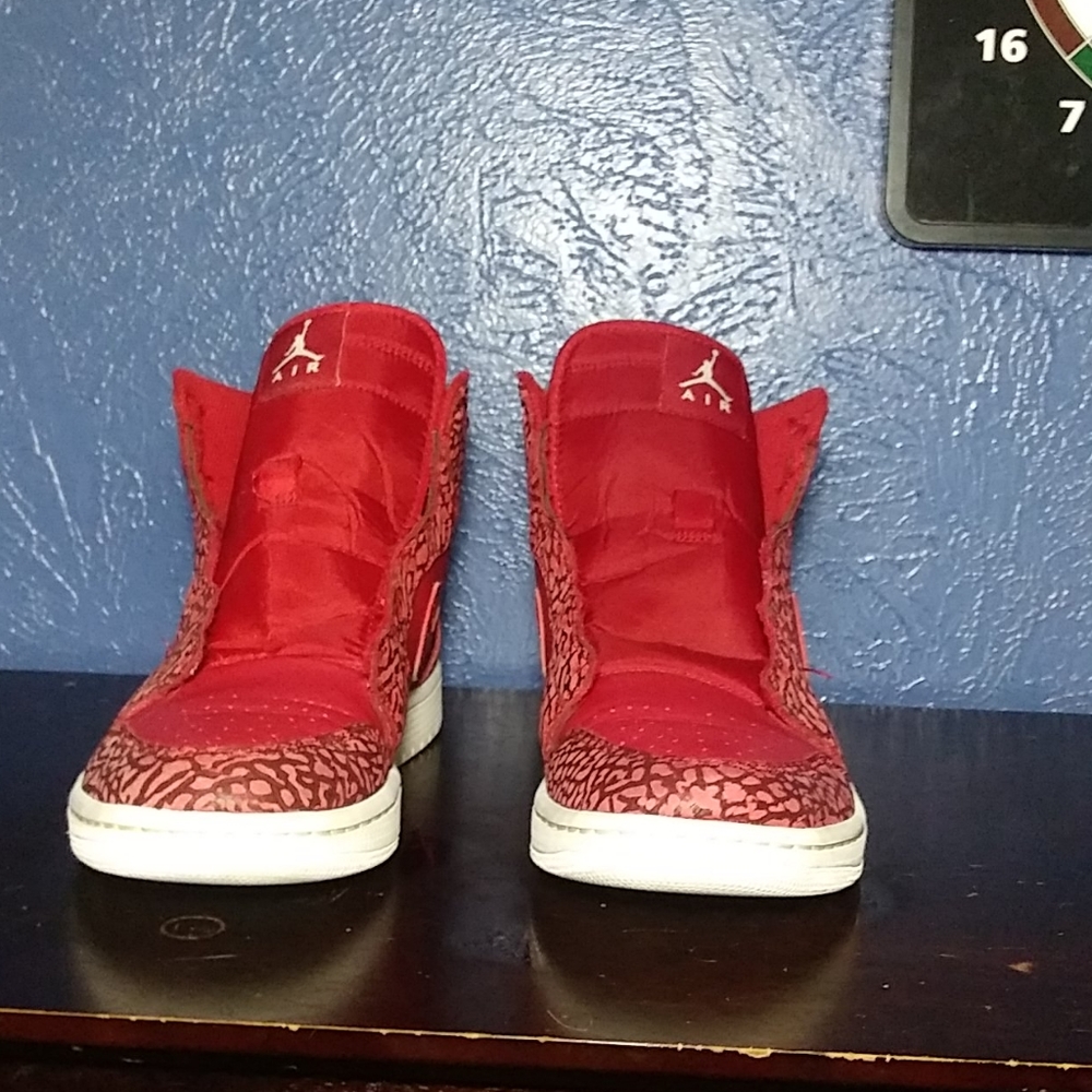 All red with white bottom Jordans